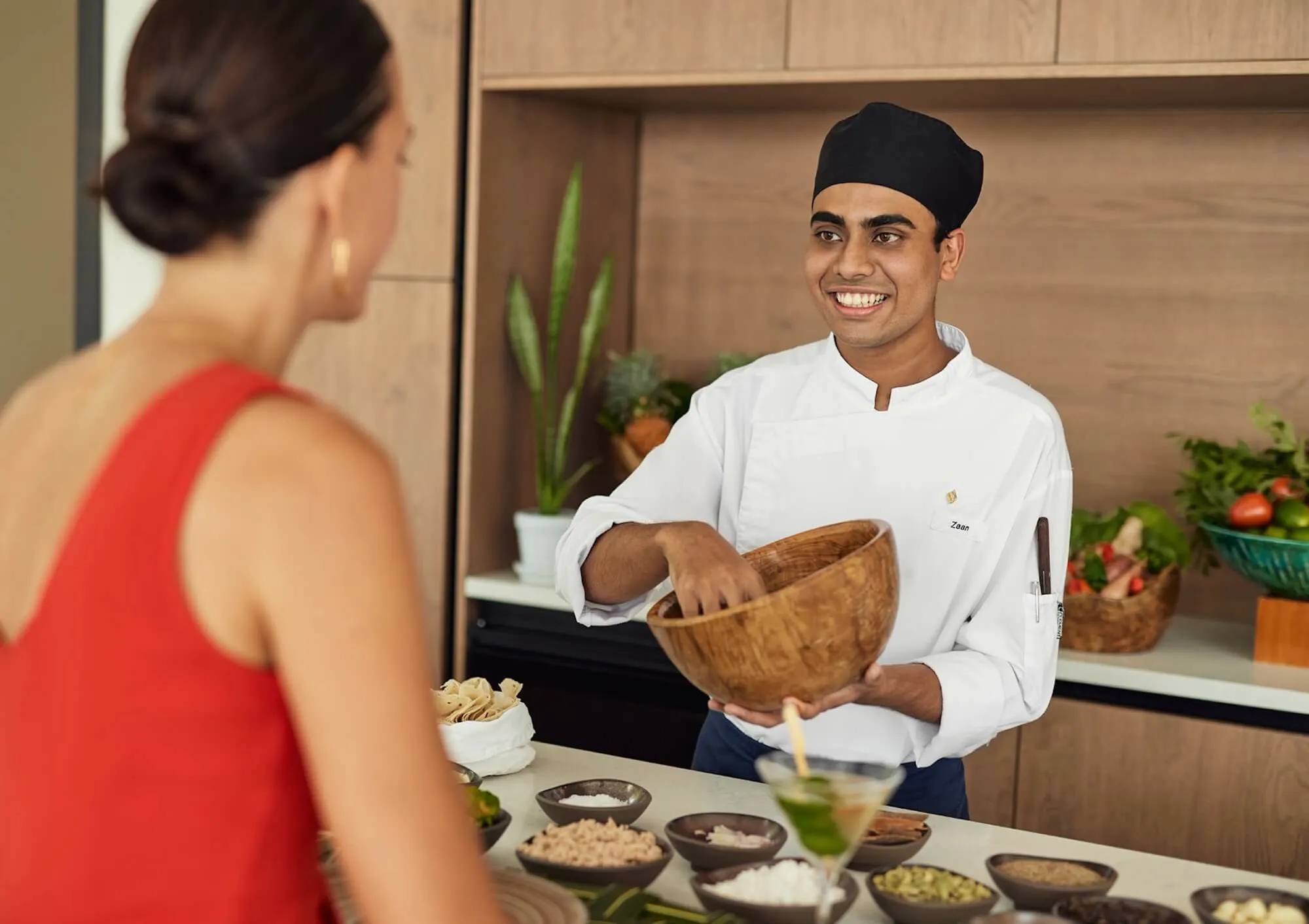 A Jumeirah chef preparing private dining for a resident, developer brochure image